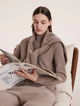 a lady in camel cashmere sweater